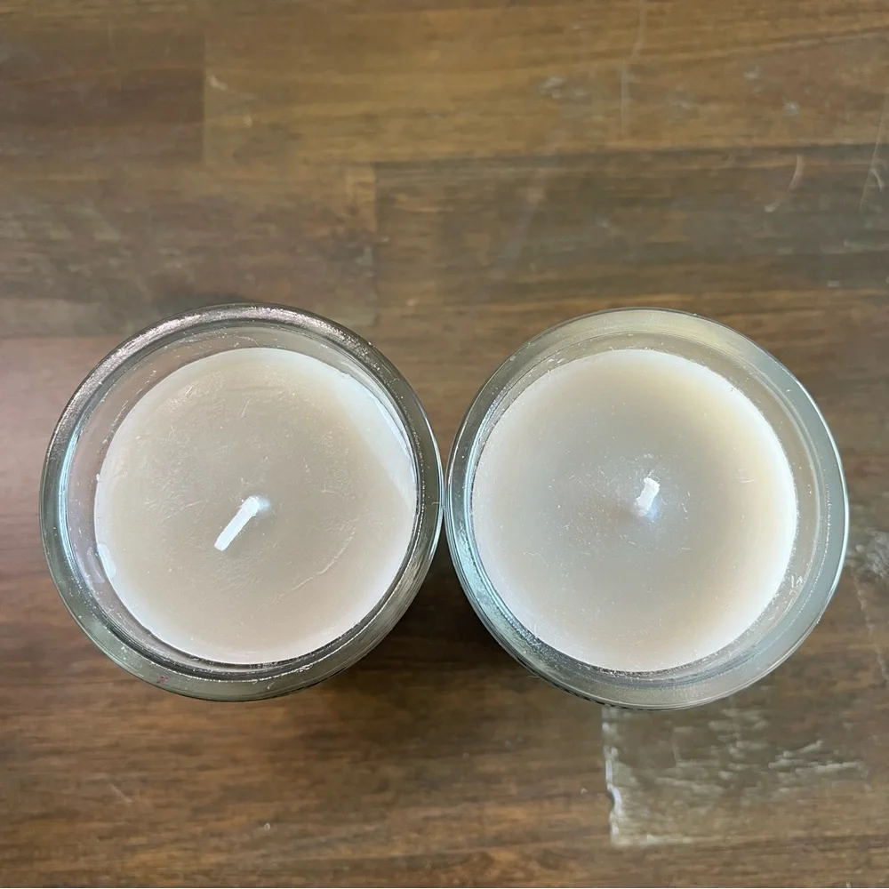 Cost Plus World Market gray Tanzanian Freesia scented candles. Set of 2 3in x 4